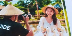 Staff taking photos with visitors